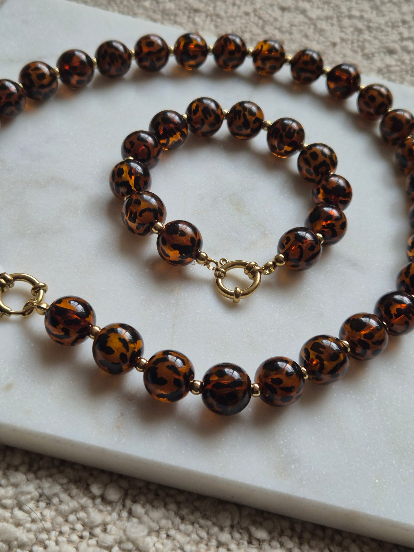Panterprint kralenketting - bruin met goud - stainless steel